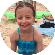 Our member Grace smiling at the beach: MedicAlert for Food Allergies