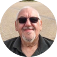 Our member Ian Graham smiling with sunglasses on: MedicAlert for Chronic Asthma, Bladder Cancer, COPD, Hypothyroidism, Arthritis & Mobility Problems