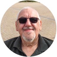 Our member Ian Graham smiling with sunglasses on: MedicAlert for Chronic Asthma, Bladder Cancer, COPD, Hypothyroidism, Arthritis & Mobility Problems