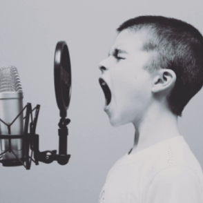 Kid shouting into a microphone