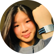 Our member Amelia Lee smiling and wearing her Heritage Bracelet: MedicAlert for Tetralogy of Fallot, Eczema & Tree Nut Allergy