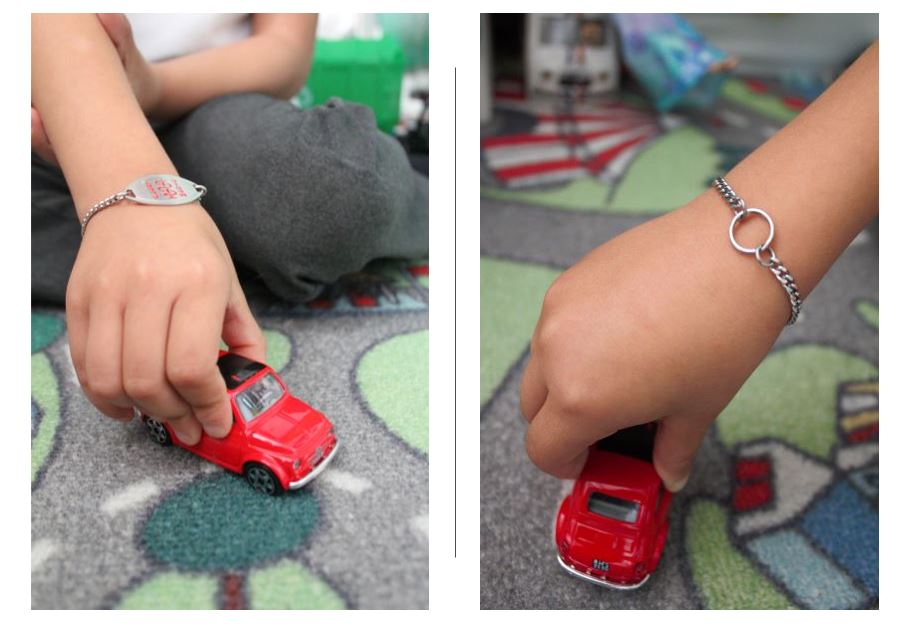 A child wearing a Forget-me-not MedicAlert bracelet pushing a toy car