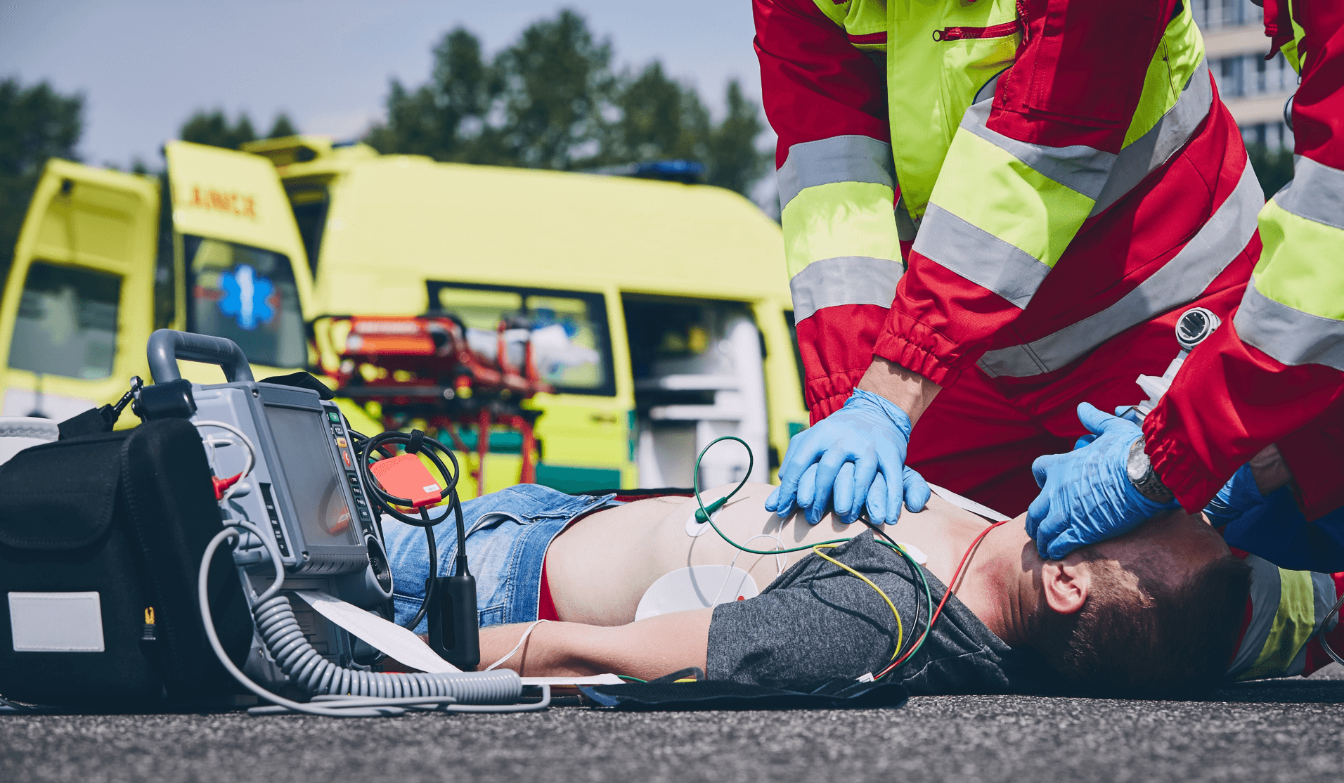 A person on the floor being treated by paramedics