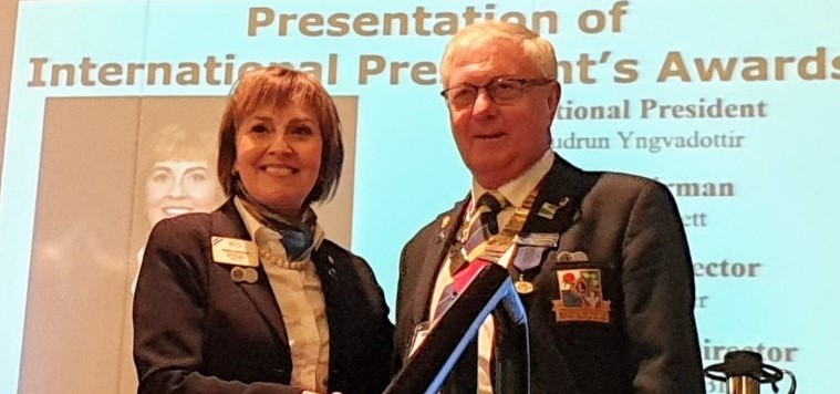 John Sutherland receiving his International President Award