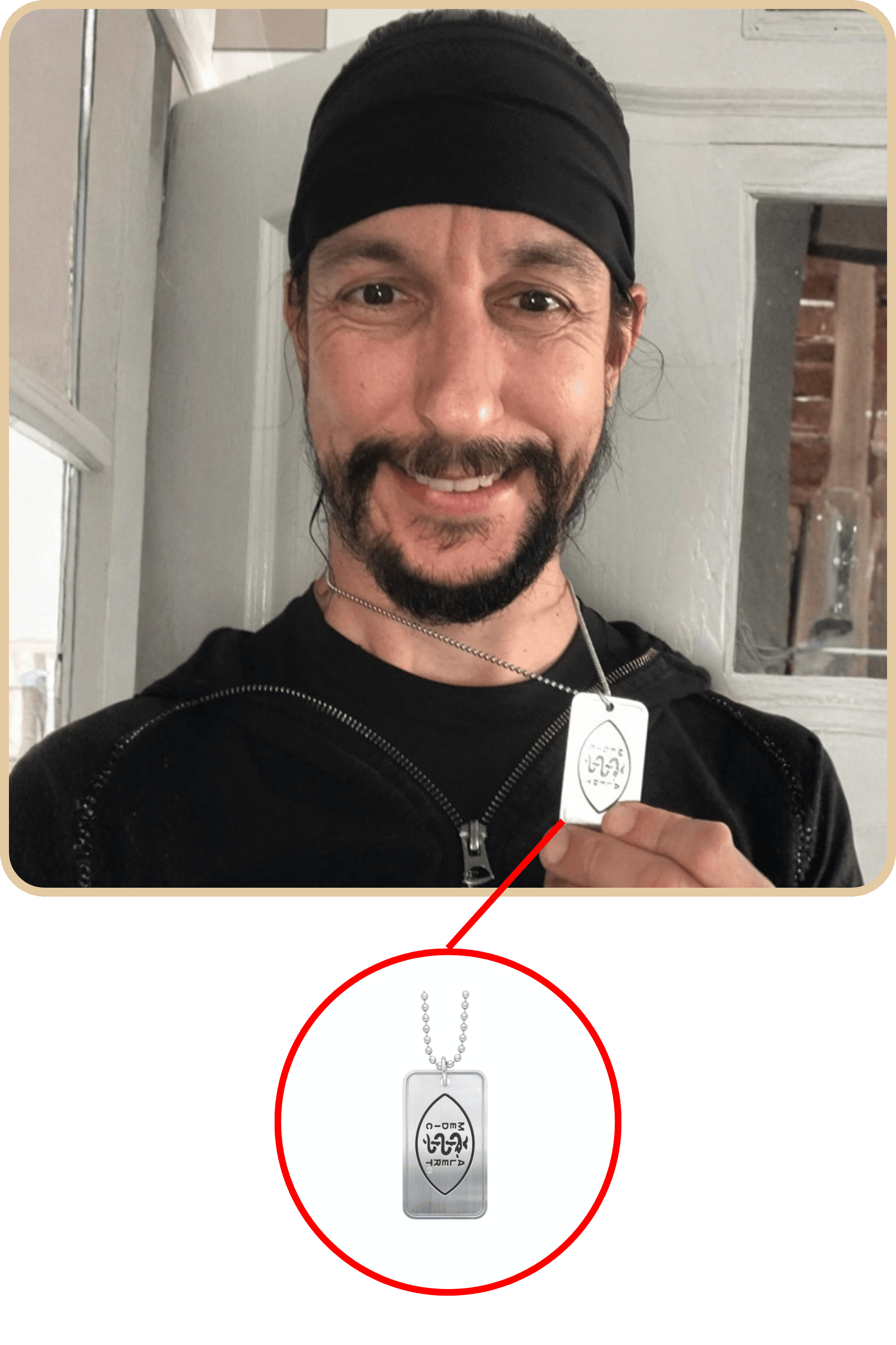 Picture of graham smiling holding his dog tag